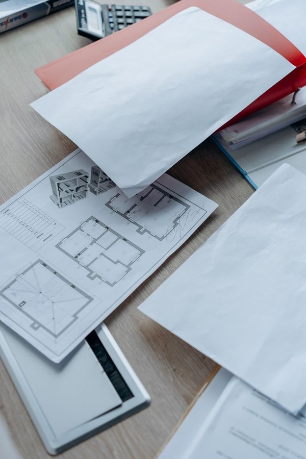 Document and paper sprawl on desk